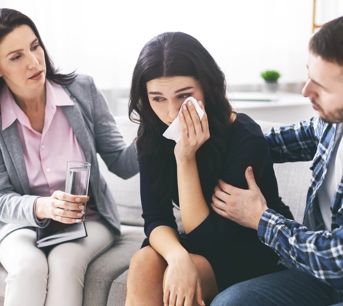 loving-husband-calming-his-crying-wife-at-psychoth-E93YAHK.jpg